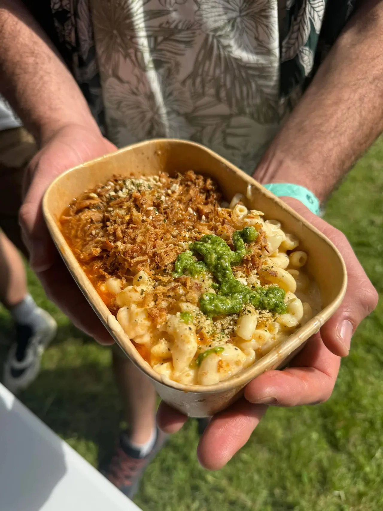 A person holding a bowl of food from Marta's Kitchen