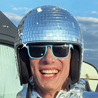 A man wearing a shiny helmet